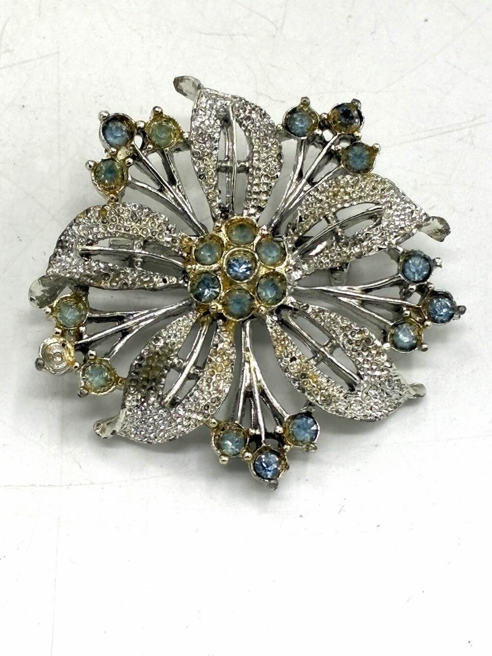 Vintage Silver Tone Blue Rhinestone Starburst Brooch Textured Leaves 2 Inch